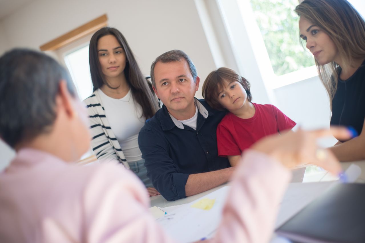 A family discussing life insurance and terminal illness cover options
