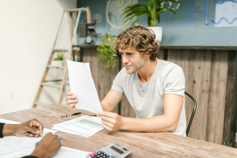A person reviewing their income protection insurance policy documents